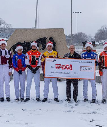 Photo – The cheque presentation following the 2022 Driver’s Holiday Challenge (courtesy Carter Gimblett)